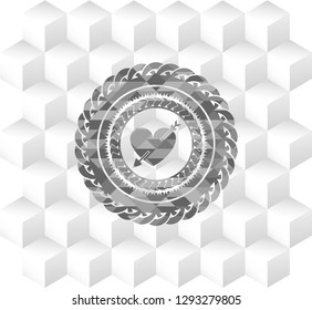 heart with arrow icon inside grey emblem with cube white background