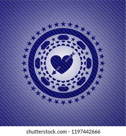 heart with arrow icon inside jean background