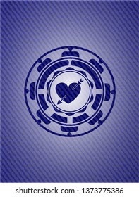 heart with arrow icon inside jean background