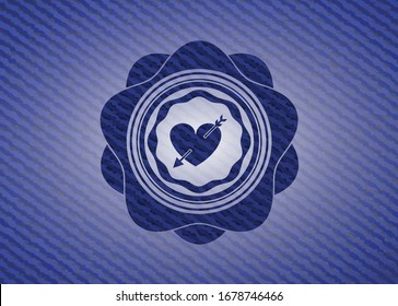 heart with arrow icon inside jean background