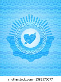 heart with arrow icon inside light blue water wave style badge.