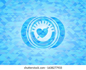 heart with arrow icon inside light blue mosaic emblem