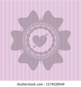 heart with arrow icon inside pink emblem