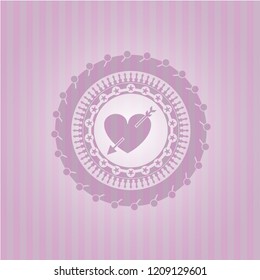 heart with arrow icon inside pink emblem