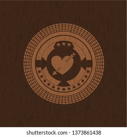 heart with arrow icon inside realistic wood emblem
