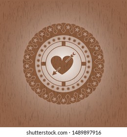 heart with arrow icon inside realistic wood emblem