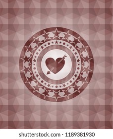 heart with arrow icon inside red seamless polygonal badge.