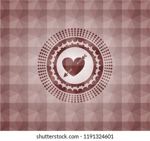 heart with arrow icon inside red seamless emblem with geometric pattern background.