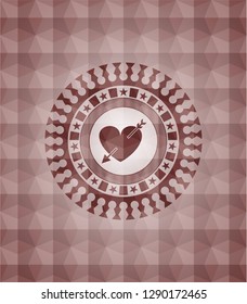 heart with arrow icon inside red seamless geometric emblem.