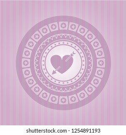 heart with arrow icon inside retro pink emblem