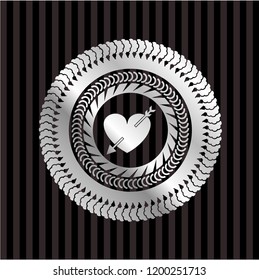heart with arrow icon inside silver shiny badge