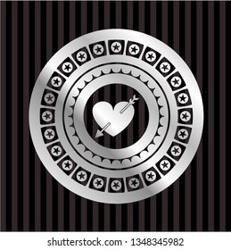 heart with arrow icon inside silver shiny emblem