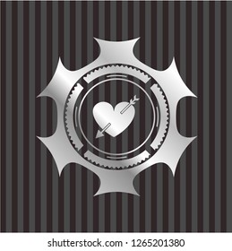 heart with arrow icon inside silvery badge