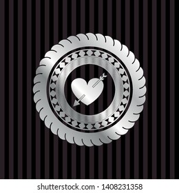 heart with arrow icon inside silvery emblem or badge