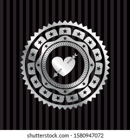 heart with arrow icon inside silvery badge or emblem