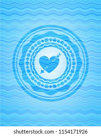 heart with arrow icon inside sky blue water style emblem.