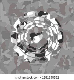 heart with arrow icon on grey camouflage pattern