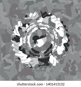 heart with arrow icon on grey camo pattern