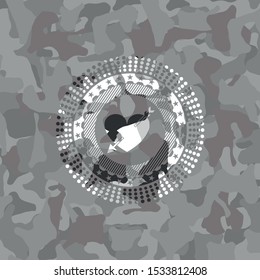 heart with arrow icon on grey camouflage pattern