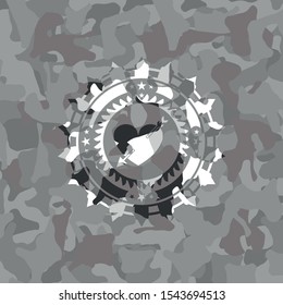 heart with arrow icon on grey camouflaged pattern