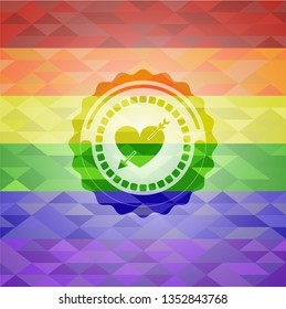heart with arrow icon on mosaic background with the colors of the LGBT flag