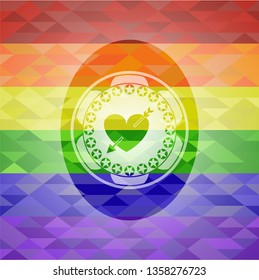 heart with arrow icon on mosaic background with the colors of the LGBT flag