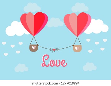 Heart balloon floating in the sky surrounding by white cloud with love text backgruond