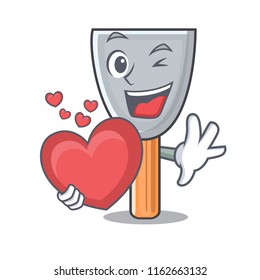 With heart cartoon putty knife in plaster
