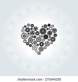 Heart consisting of gears in motion on  light background