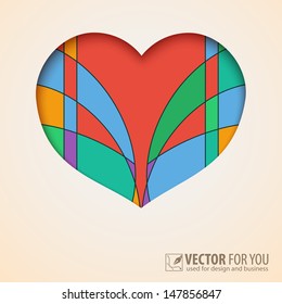 Heart cut out of paper with abstract, colored background