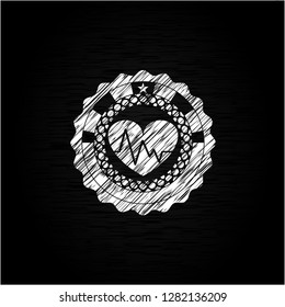 heart with electrocardiogram icon drawn with chalkboard texture