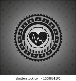 heart with electrocardiogram icon inside black emblem