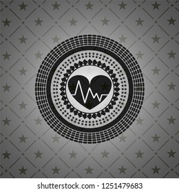 heart with electrocardiogram icon inside black badge