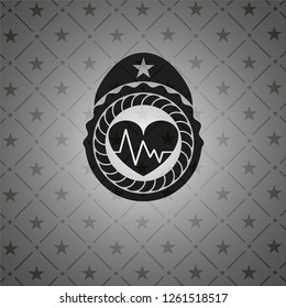 heart with electrocardiogram icon inside black badge