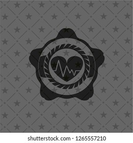 heart with electrocardiogram icon inside black badge