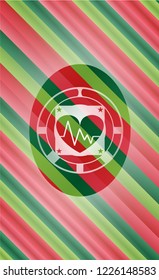 heart with electrocardiogram icon inside christmas style emblem.