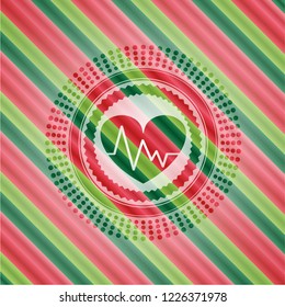 heart with electrocardiogram icon inside christmas colors badge.