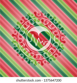 heart with electrocardiogram icon inside christmas colors style emblem.