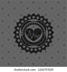 heart with electrocardiogram icon inside dark badge