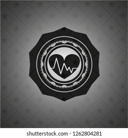 heart with electrocardiogram icon inside dark emblem