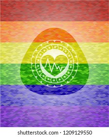 heart with electrocardiogram icon inside emblem on mosaic background with the colors of the LGBT flag