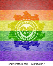 heart with electrocardiogram icon inside emblem on mosaic background with the colors of the LGBT flag