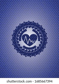 heart with electrocardiogram icon inside emblem with denim high quality background