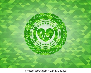 heart with electrocardiogram icon inside green emblem with mosaic background
