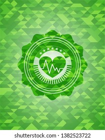 heart with electrocardiogram icon inside green mosaic emblem