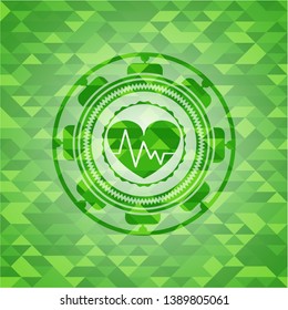 heart with electrocardiogram icon inside green emblem with mosaic ecological style background