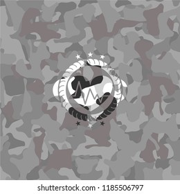 heart with electrocardiogram icon inside grey camo texture