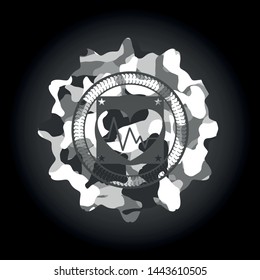 heart with electrocardiogram icon inside grey camouflage emblem