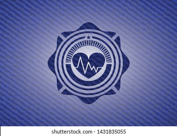 heart with electrocardiogram icon inside jean background