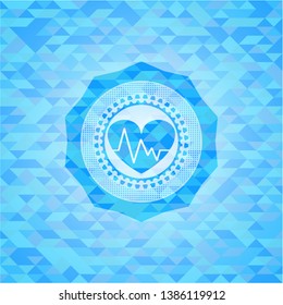 heart with electrocardiogram icon inside light blue mosaic emblem